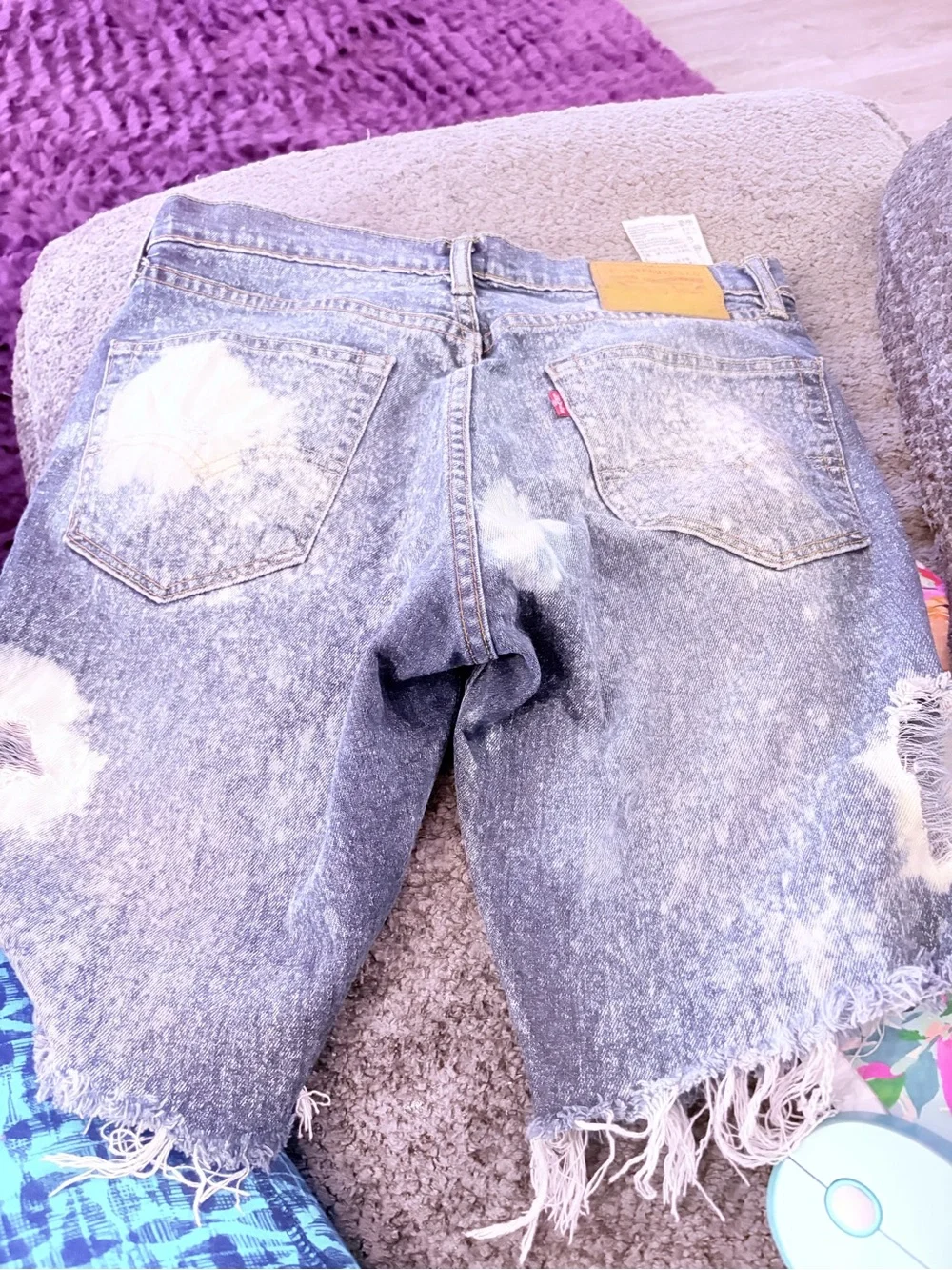 Levi's light blue denim shorts with frayed hem